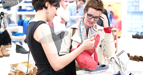 Image of best friend shopping in big mall