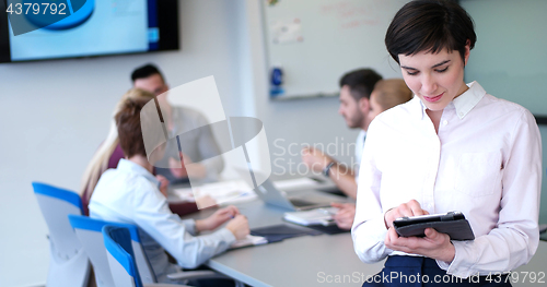 Image of Portrait of  smiling casual businesswoman using tablet  with cow