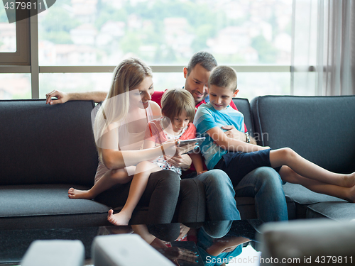 Image of young cuple spending time with kids