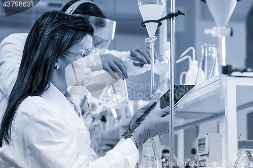 Image of Chemists researching in life science laboratory.