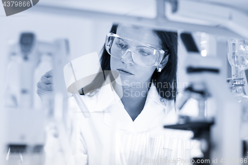 Image of Female chemist working in scientific laboratory.