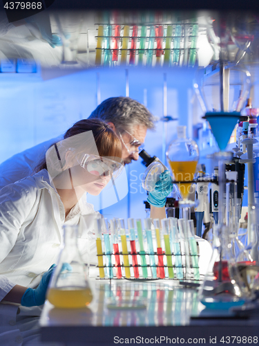 Image of Health care professionals researching in scientific laboratory.