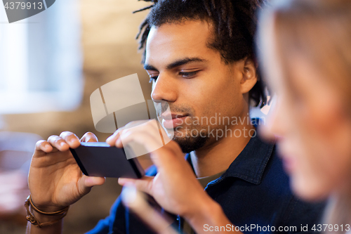 Image of close up of man with smartphone