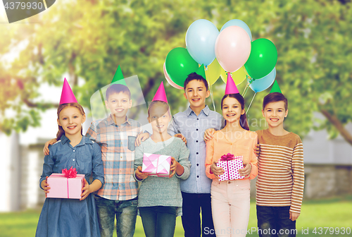 Image of happy children with gifts at birthday party