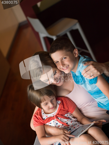 Image of Young Family Using A Tablet To Make Future Plans