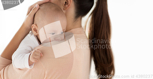 Image of close up of little baby boy with mother