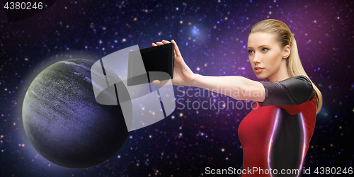 Image of futuristic woman with tablet pc over space