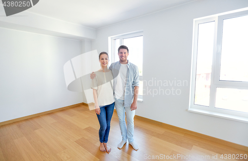 Image of happy couple hugging at new home