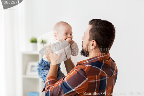 Image of happy little baby boy with father