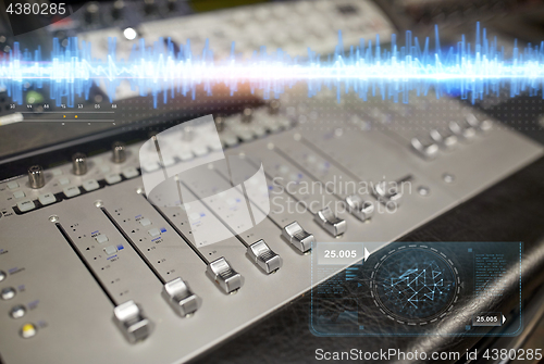 Image of music mixing console at sound recording studio