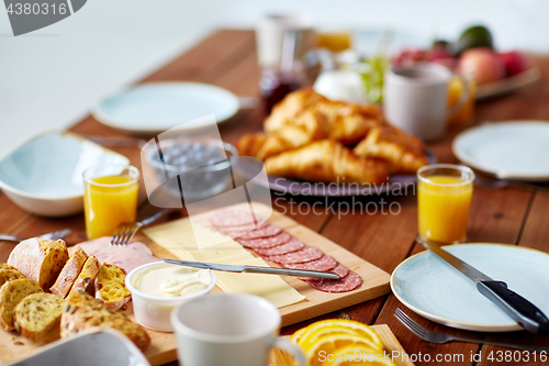 Image of food on served wooden table at breakfast