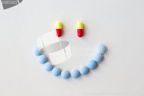 Image of smiley of different pills and capsules of drugs