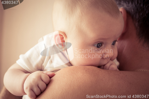 Image of Father Holding Newborn Baby Son