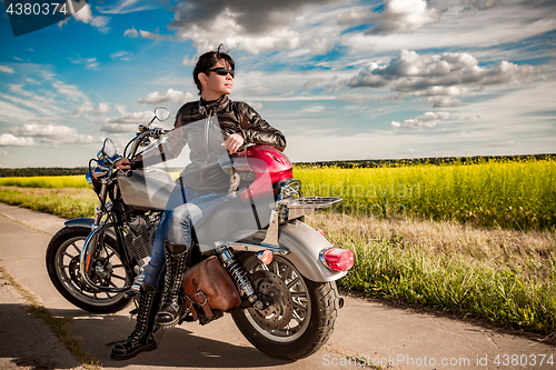 Image of Biker girl on a motorcycle