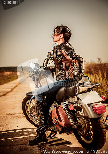 Image of Biker girl on a motorcycle