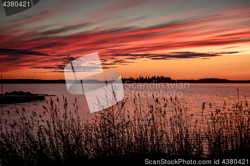 Image of Crimson sunset on the background of the Gulf of Bothnia