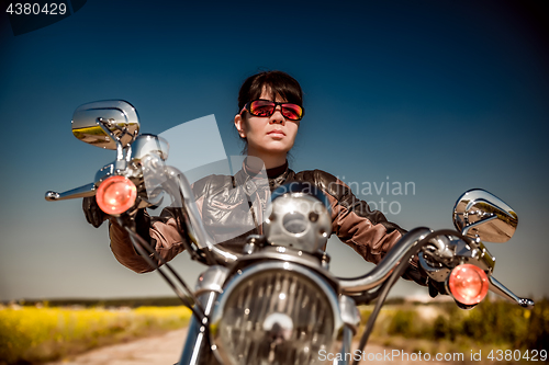 Image of Biker girl on a motorcycle