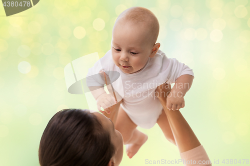 Image of happy mother playing with little baby boy