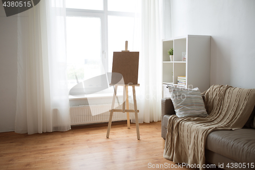 Image of wooden easel at home room or art studio