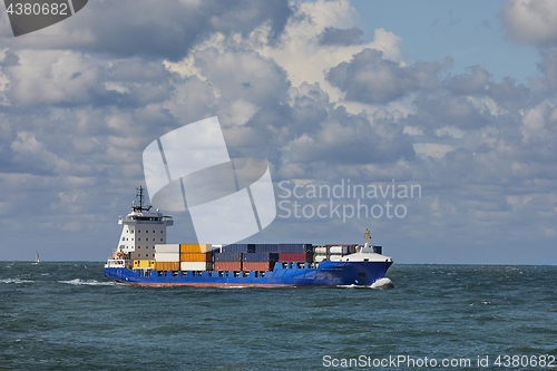 Image of Ship carrying containers onboard