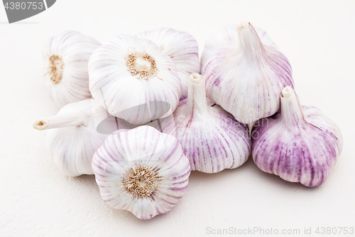 Image of garlic bulbs on white background