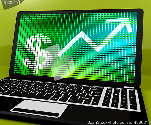 Image of Dollar Sign And Up Arrow On Laptop For Earnings Or Profit