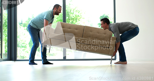 Image of men carry the sofa