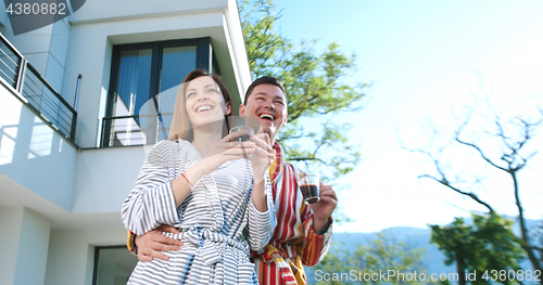 Image of drinking coffee on terrace of villa in the morning