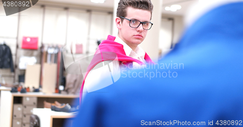 Image of Attractive Couple Shopping In A Man\'s Clothing Store