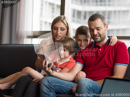 Image of young cuple spending time with kids