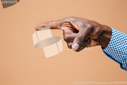 Image of Black male hand point finger. Hand gestures - man pointing on virtual object