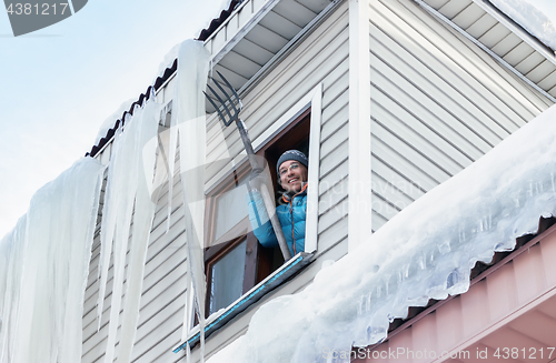 Image of Snow And Icicles Removal From The Roof