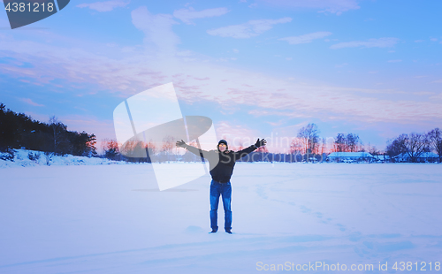 Image of Inspired Traveller With His Arms Raised Enjoys The Romantic Suns