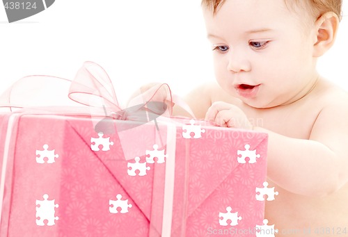 Image of baby boy with puzzle gift box