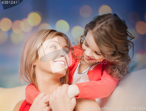 Image of happy mother and daughter hugging