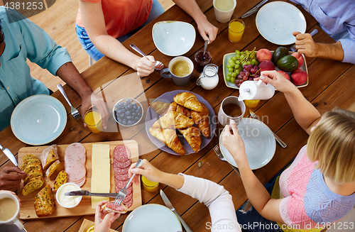 Image of group of people having breakfast at table