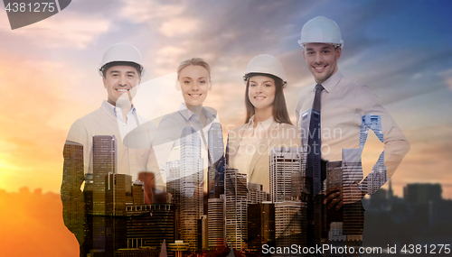 Image of business team in white hard hats