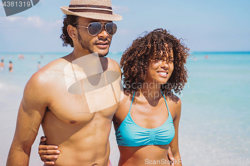 Image of Ethnic couple embracing at seaside
