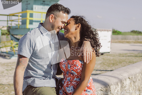 Image of Happy multiracial couple on seafront