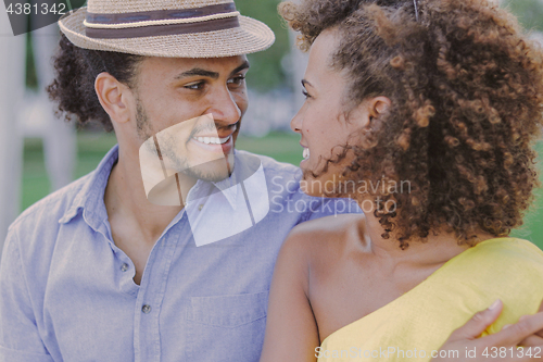 Image of Cheerful couple looking at each other