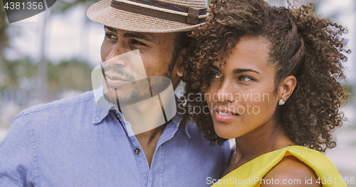 Image of Ethnic couple looking away