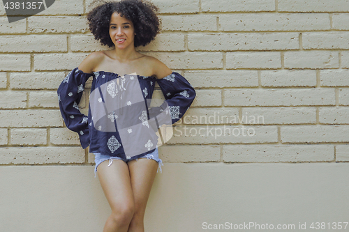 Image of Stylish black woman in summer outfit
