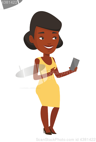 Image of Young smiling woman holding mobile phone.