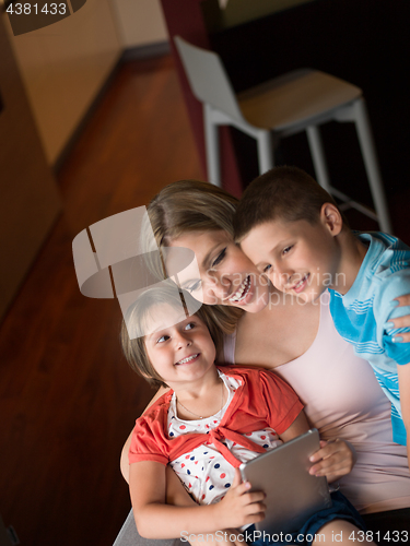 Image of Young Family Using A Tablet To Make Future Plans