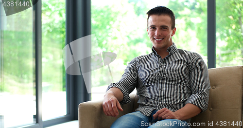 Image of Happy Man Watching Television