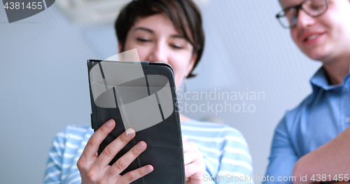 Image of low angle shot of business people using technology