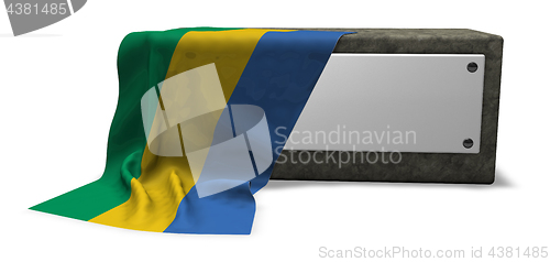 Image of stone socket and flag of gabon