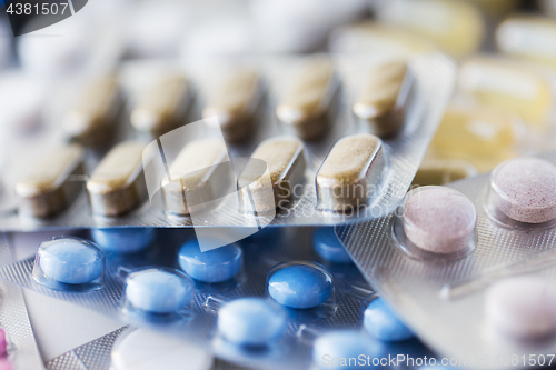 Image of different pills and capsules of drugs