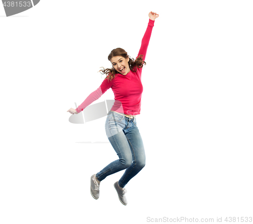 Image of smiling young woman jumping in air