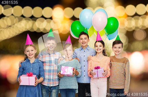 Image of happy children with gifts at birthday party